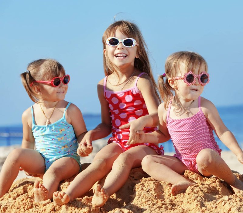 Happy,Kids,Playing,At,The,Beach,In,Summer